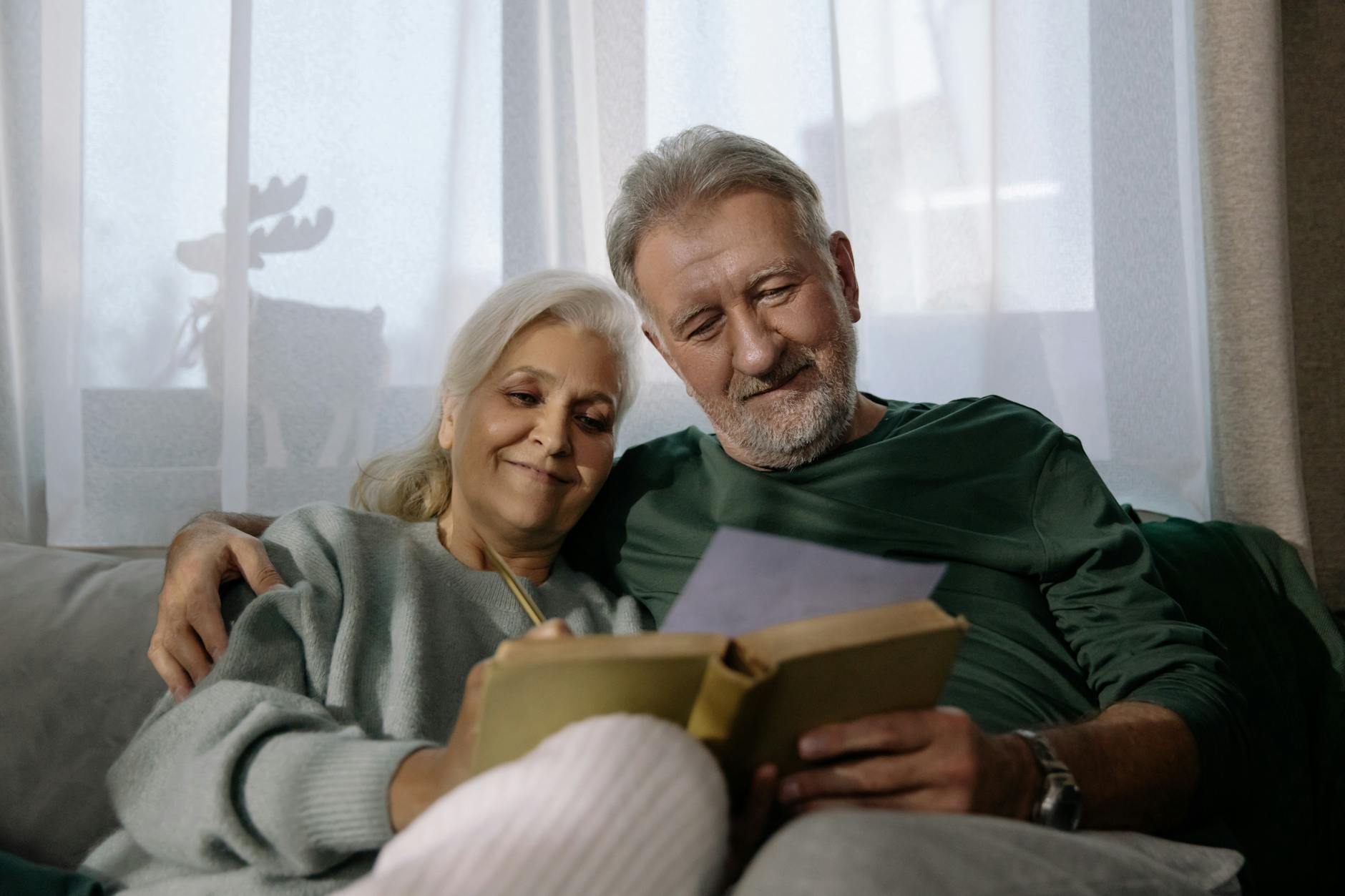 a couple reading a book